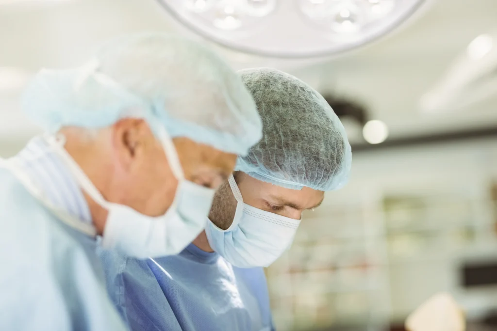 Older surgeon teaching